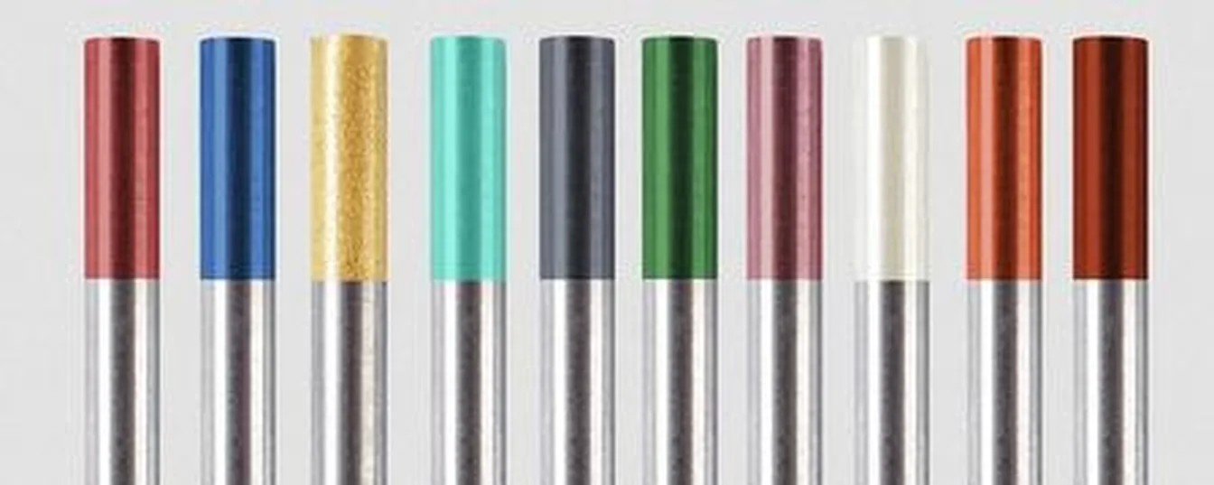 Ten tungsten electrode tips in a row showing ISO 6848 colour codes green red grey gold blue white brown yellow